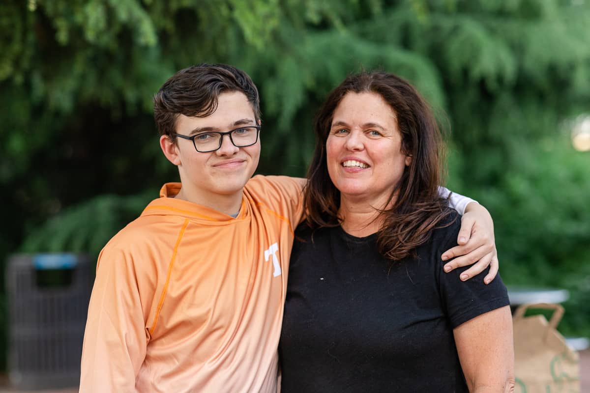 Senior boy hugging his mom